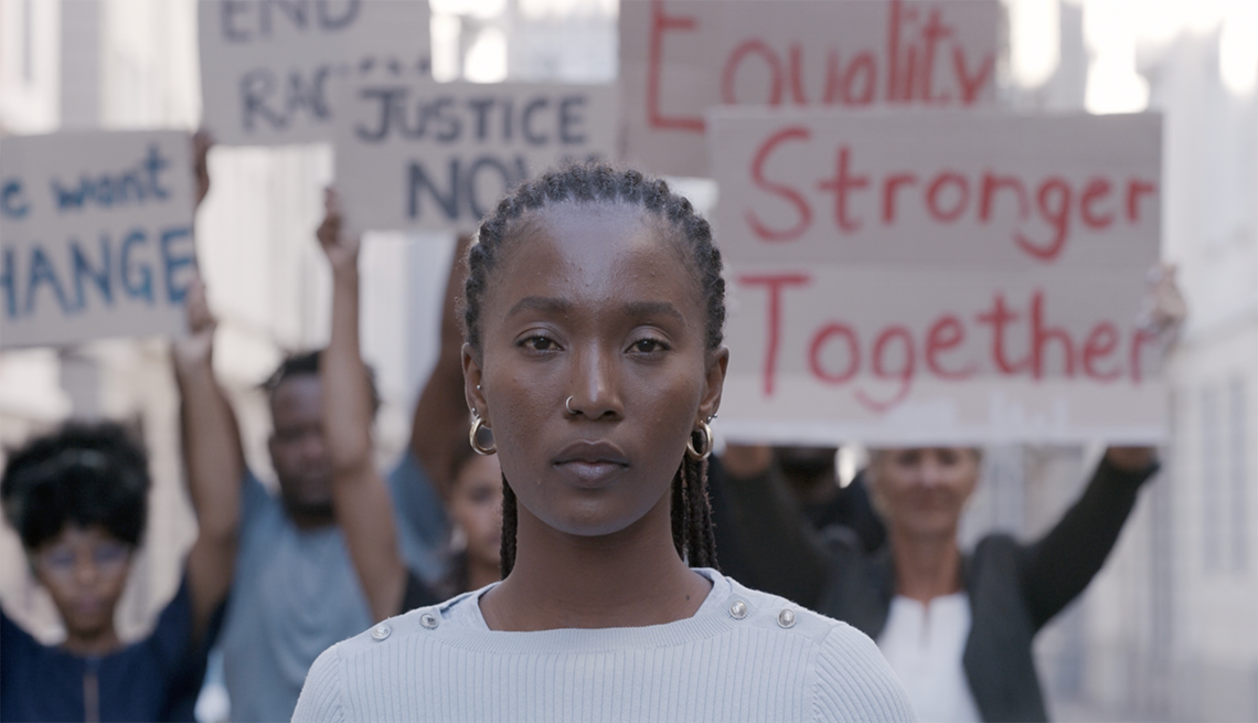 Diverse group of people standing together in the street during a protest