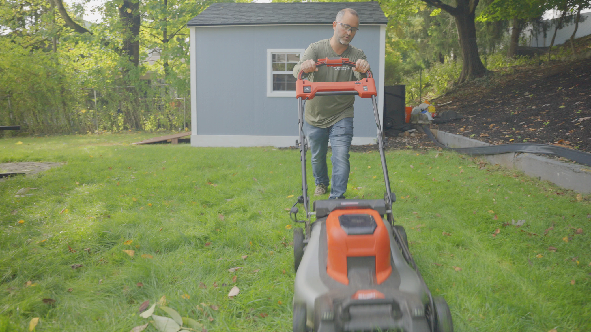 a man mowing a yard
