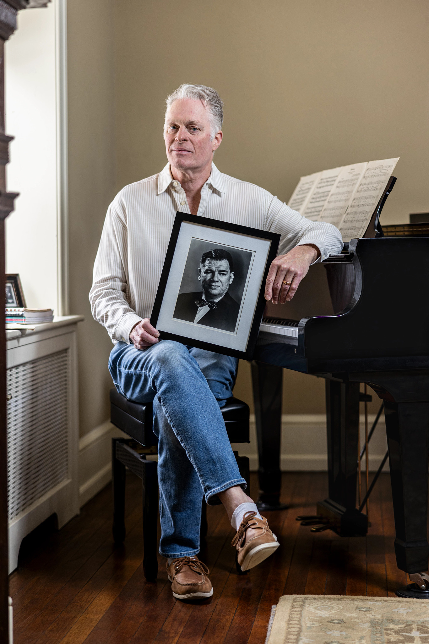 will hammerstein holds a framed portrait of his grandfather