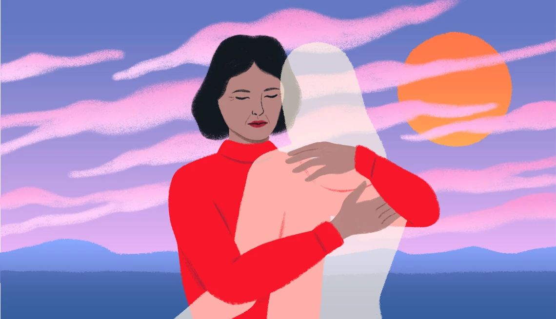 a woman hugs a see through figure meant to represent a ghost