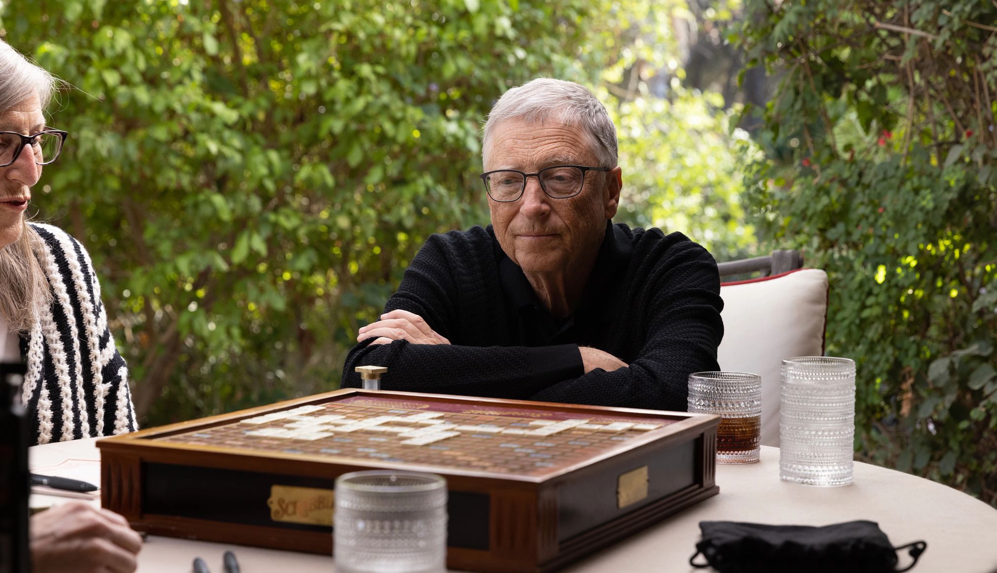 What's Next: The Future with Bill Gates Bill Gates looking at a board game in the Netflix documentary What's Next: The Future with Bill Gates