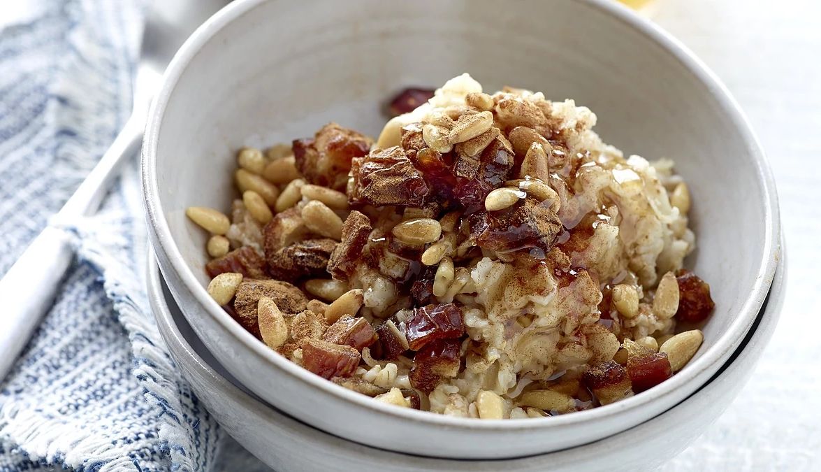 Date and pine nut oatmeal A close-up view of date and pine nut oatmeal in a bowl