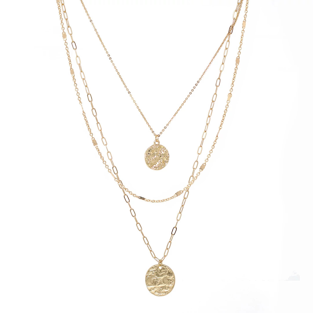 Layered gold chain necklaces with textured coin pendants displayed against a white background