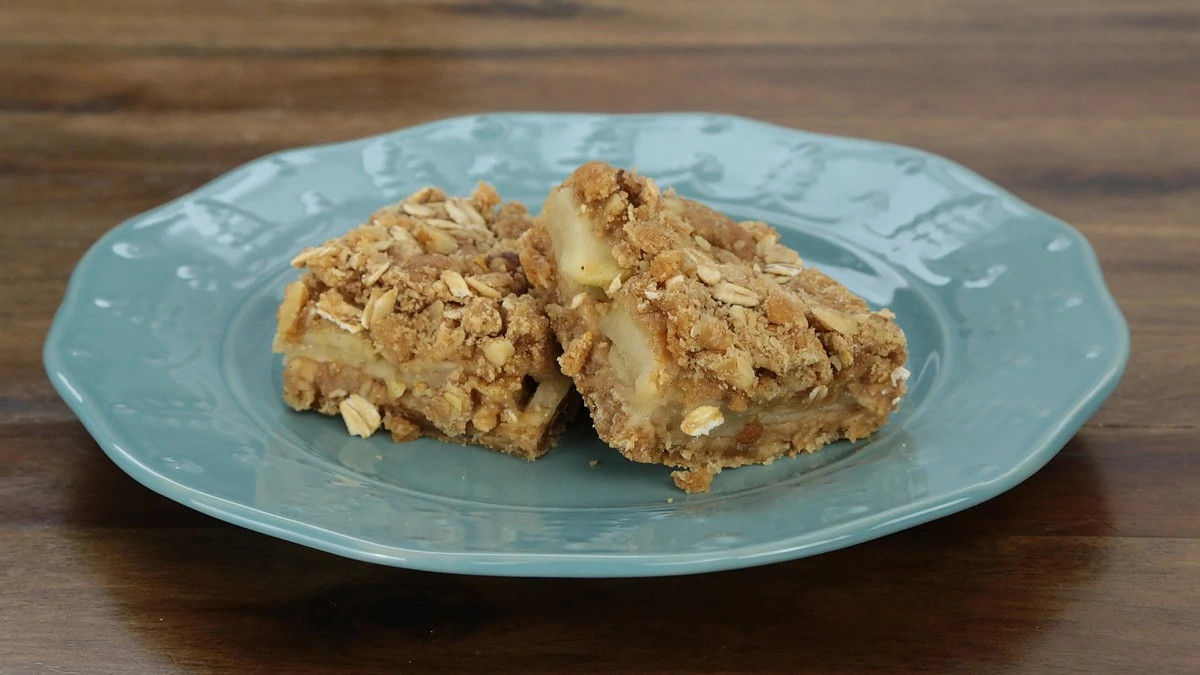 A close-up view of fresh apple squares on a plate