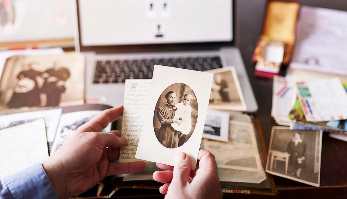 How to Turn Your Hobbies Into Cash Man sitting on table doing research on family members for family tree