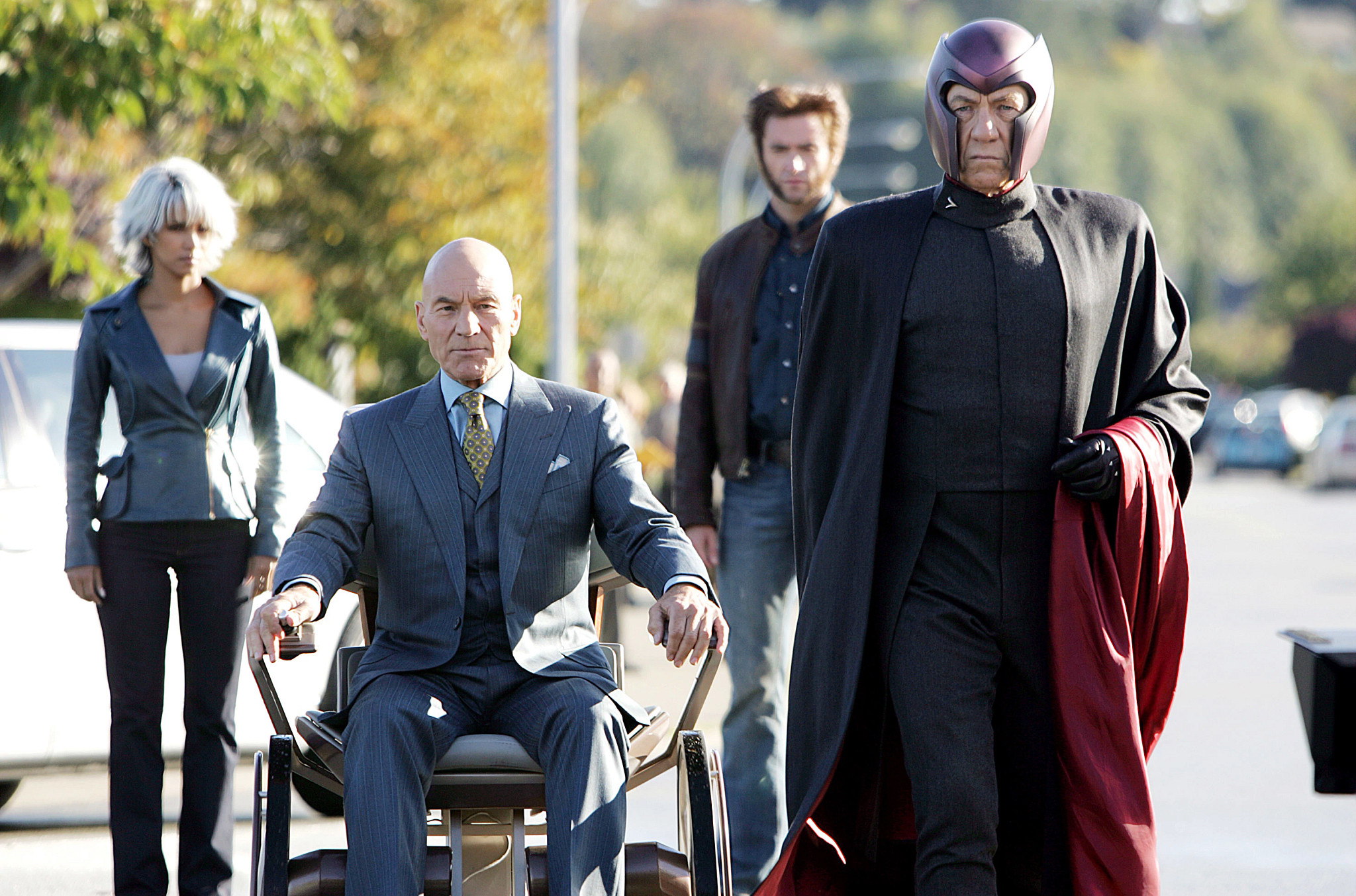 halle berry, patrick stewart, hugh jackman and ian mckellen portrayed as their x-men characters lined up in a row