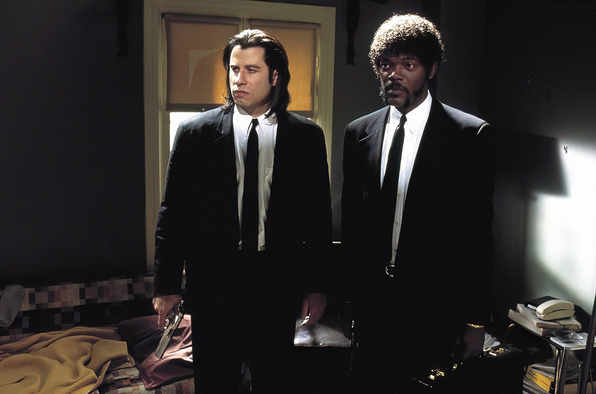 a scene from pulp fiction featuring john travolta and samual l jackson