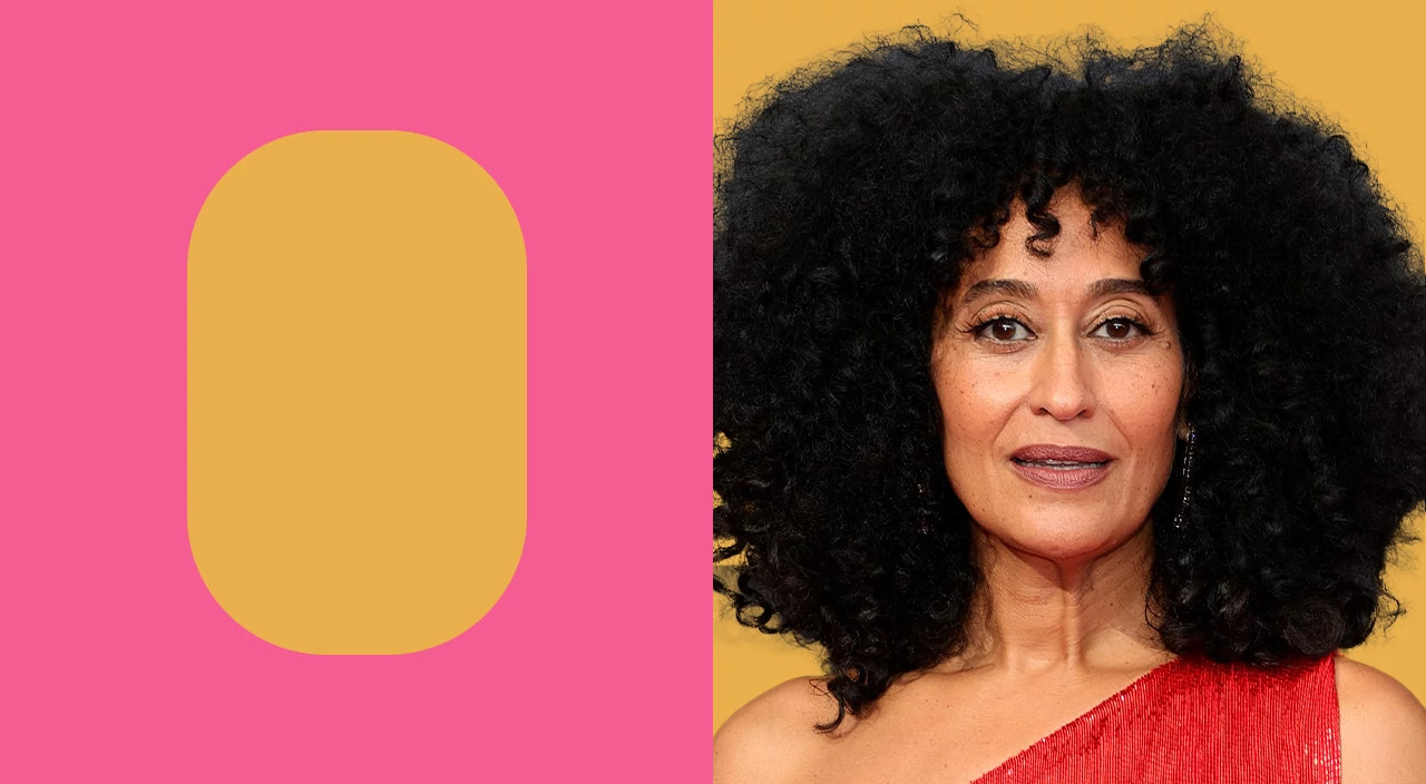 Tracee Ellis Ross with voluminous curly hair framing an oval face shape while wearing a red top