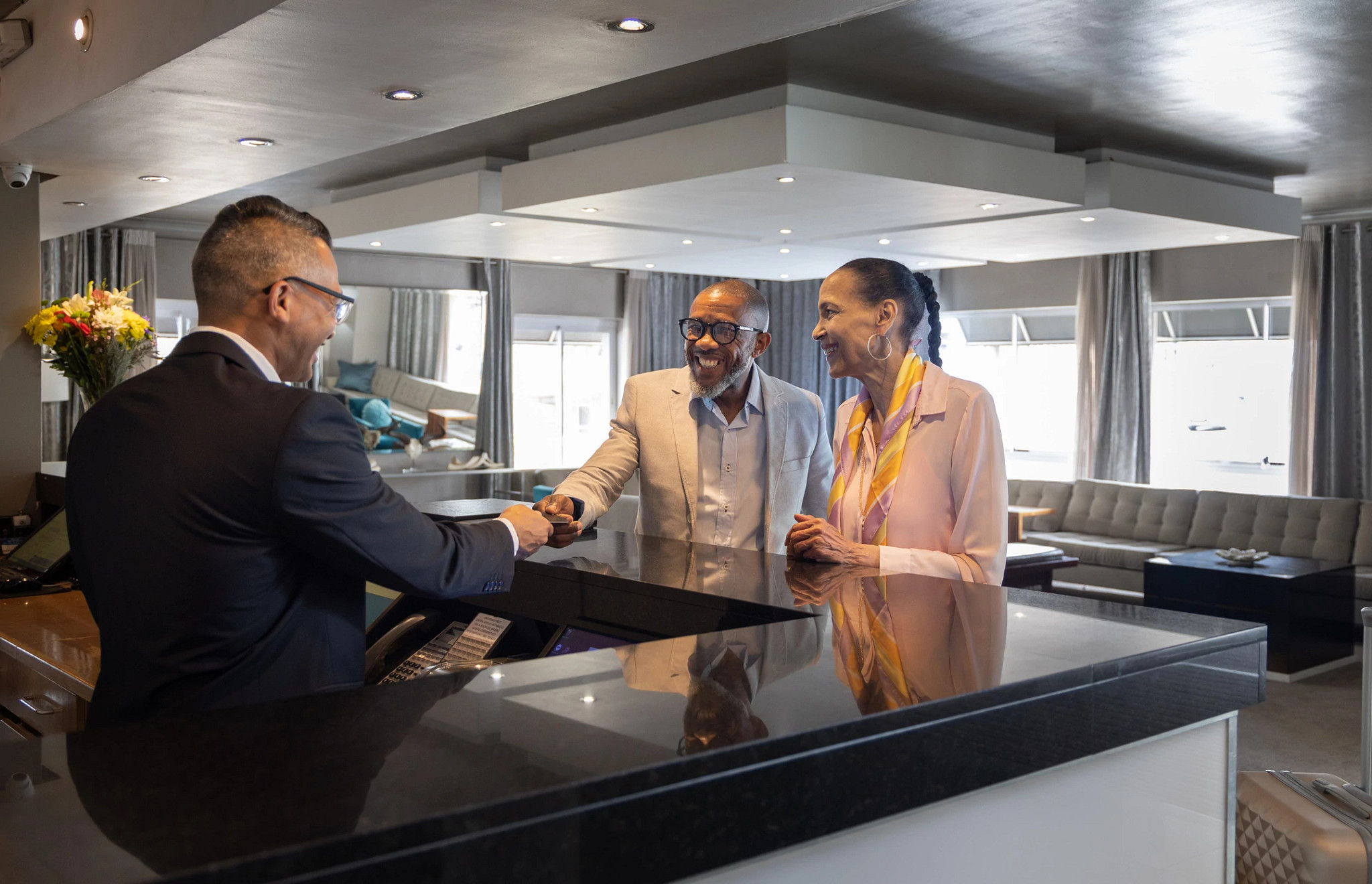 people checking into a hotel 