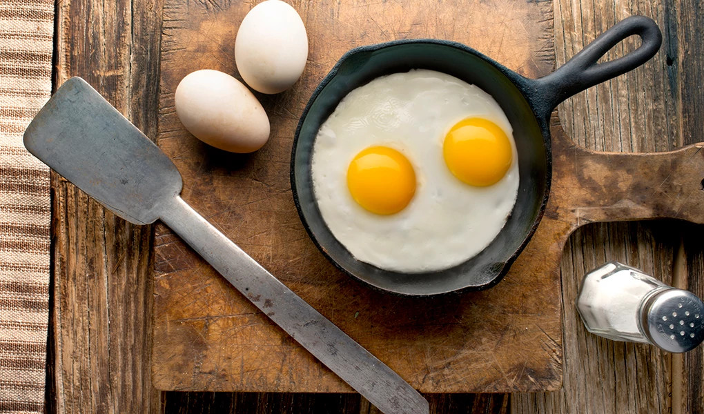 A close-up view of eggs in a pan