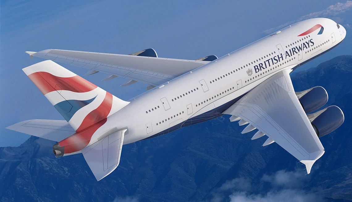 British Airways airplane in flight over blue sky