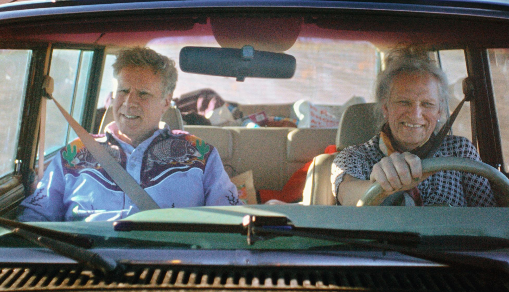 Will and Harper Will Ferrell sitting in the passenger seat of a car while Harper Steele drives in the Netflix documentary Will and Harper