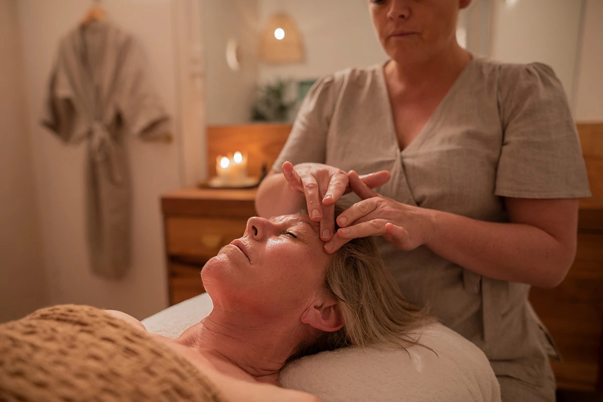 a woman getting a massage at a resort