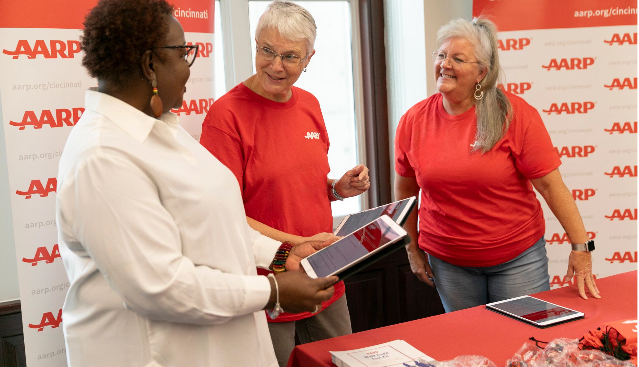 AARP community volunteers at a resource table AARP community volunteers at a resource table