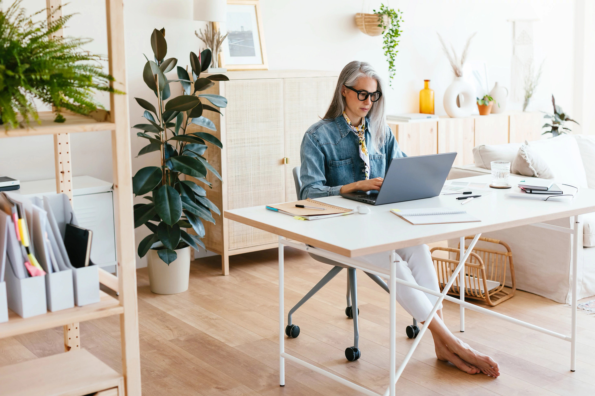 Middle Aged Woman Using Laptop In Home Office