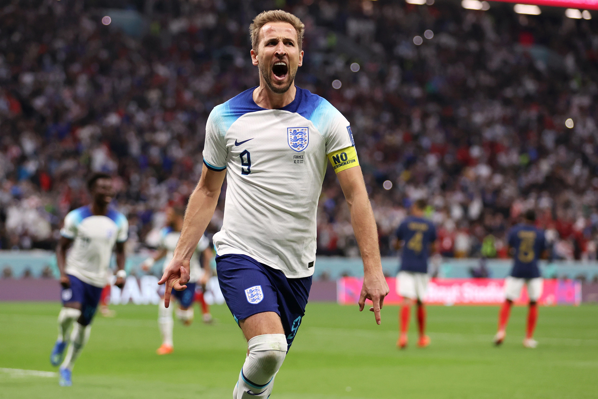 harry kane shouting in celebration during a soccer match