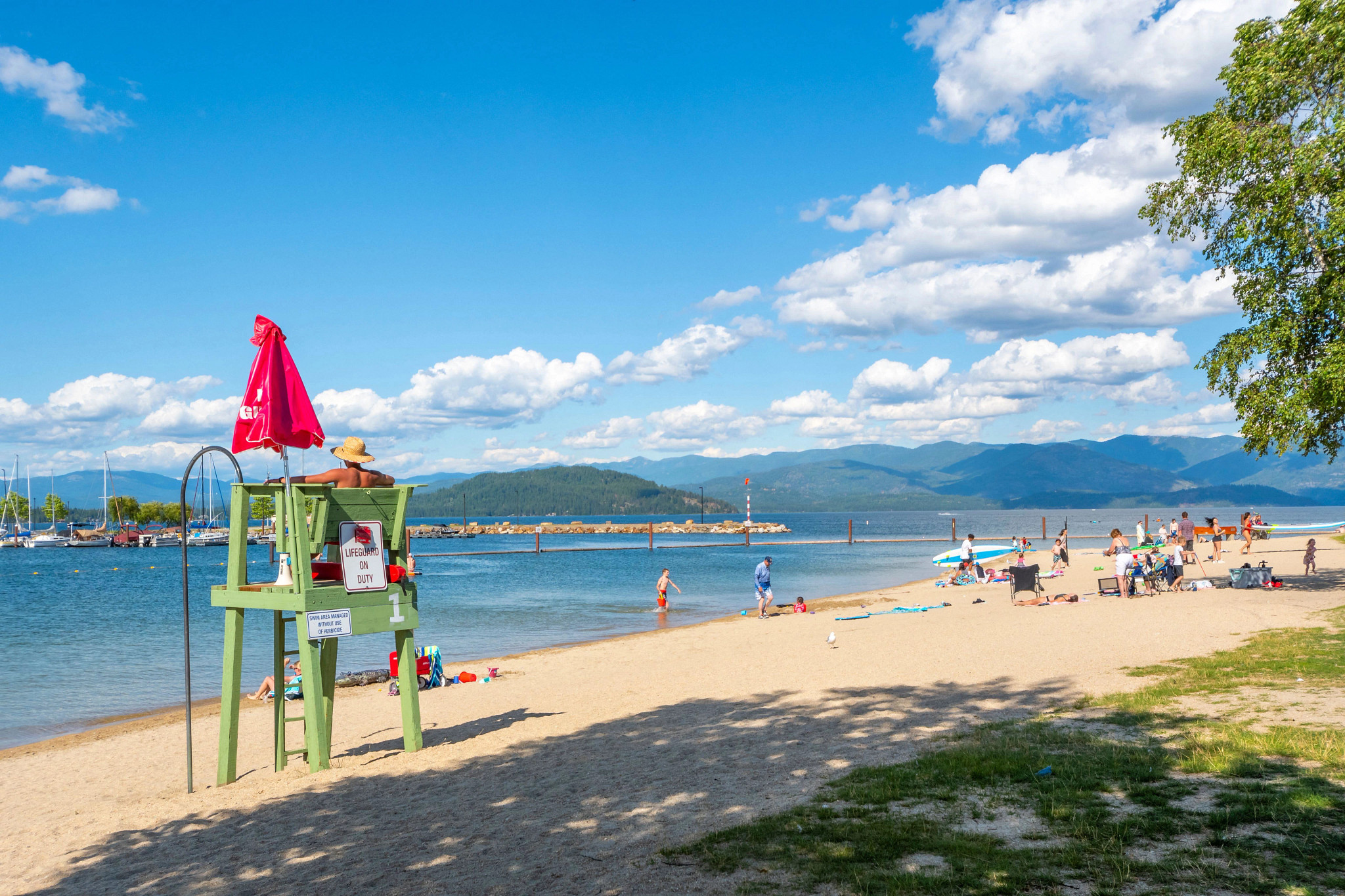 beachgoers and a lifeguard at Lake Pend Oreille in Sandpoint, Idaho