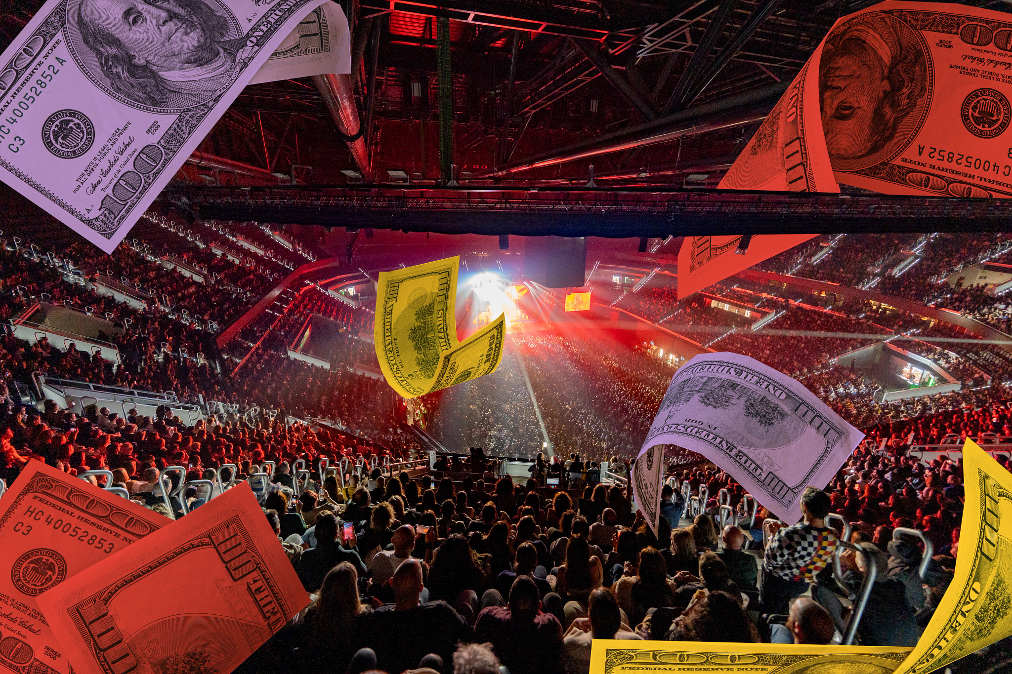 Hundred dollar bills float through a concert venue during a show.