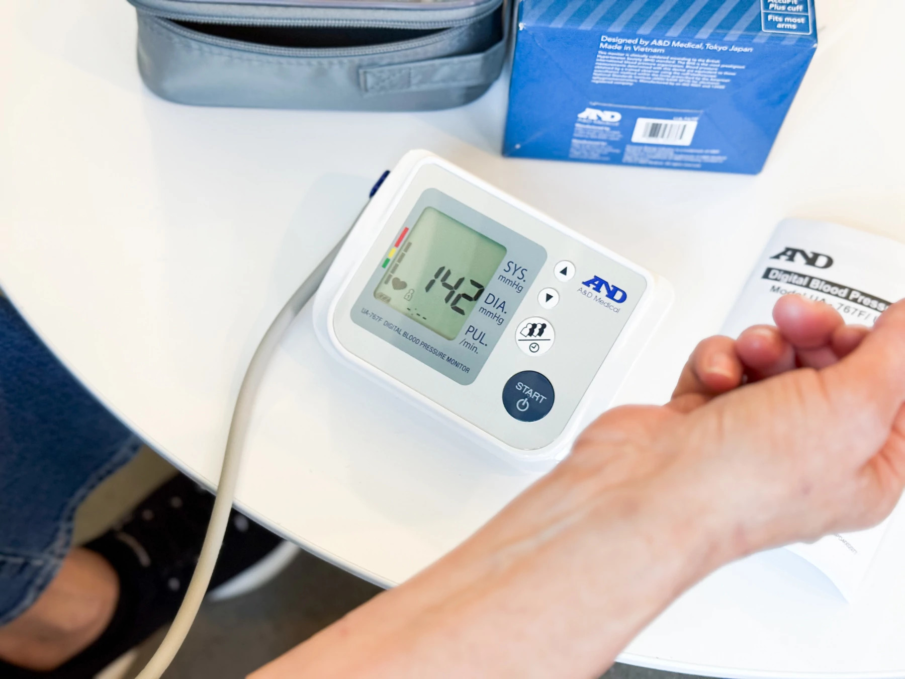 The A&D Medical Premium Multi-User blood pressure monitor while in use.