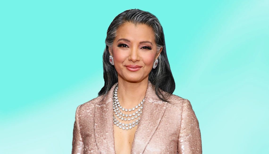 Kelly Hu interview Kelly Hu against light blue ombre background