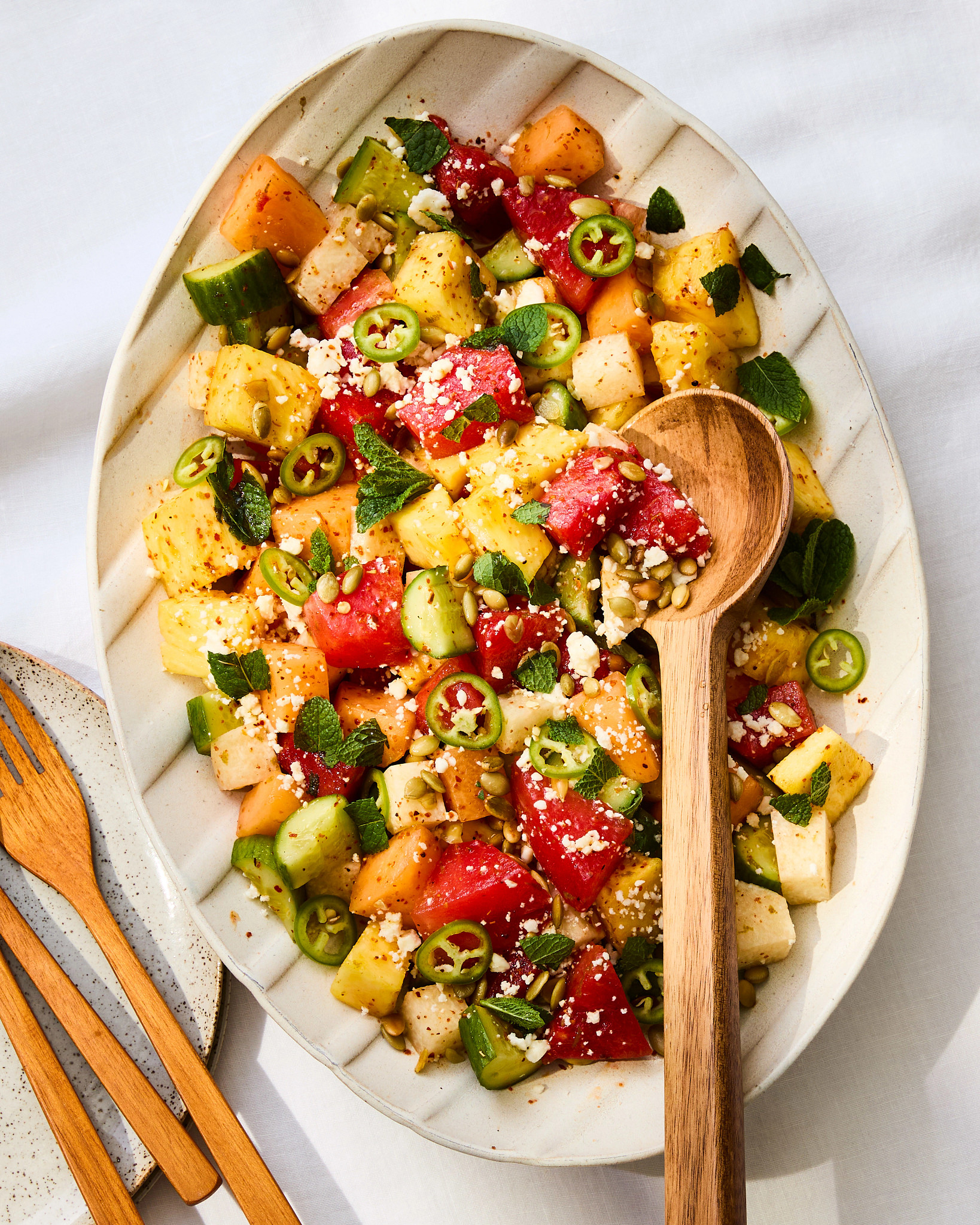 Sweet and Spicy Mexican Fruit Salad with Tajin Vinaigrette is shown