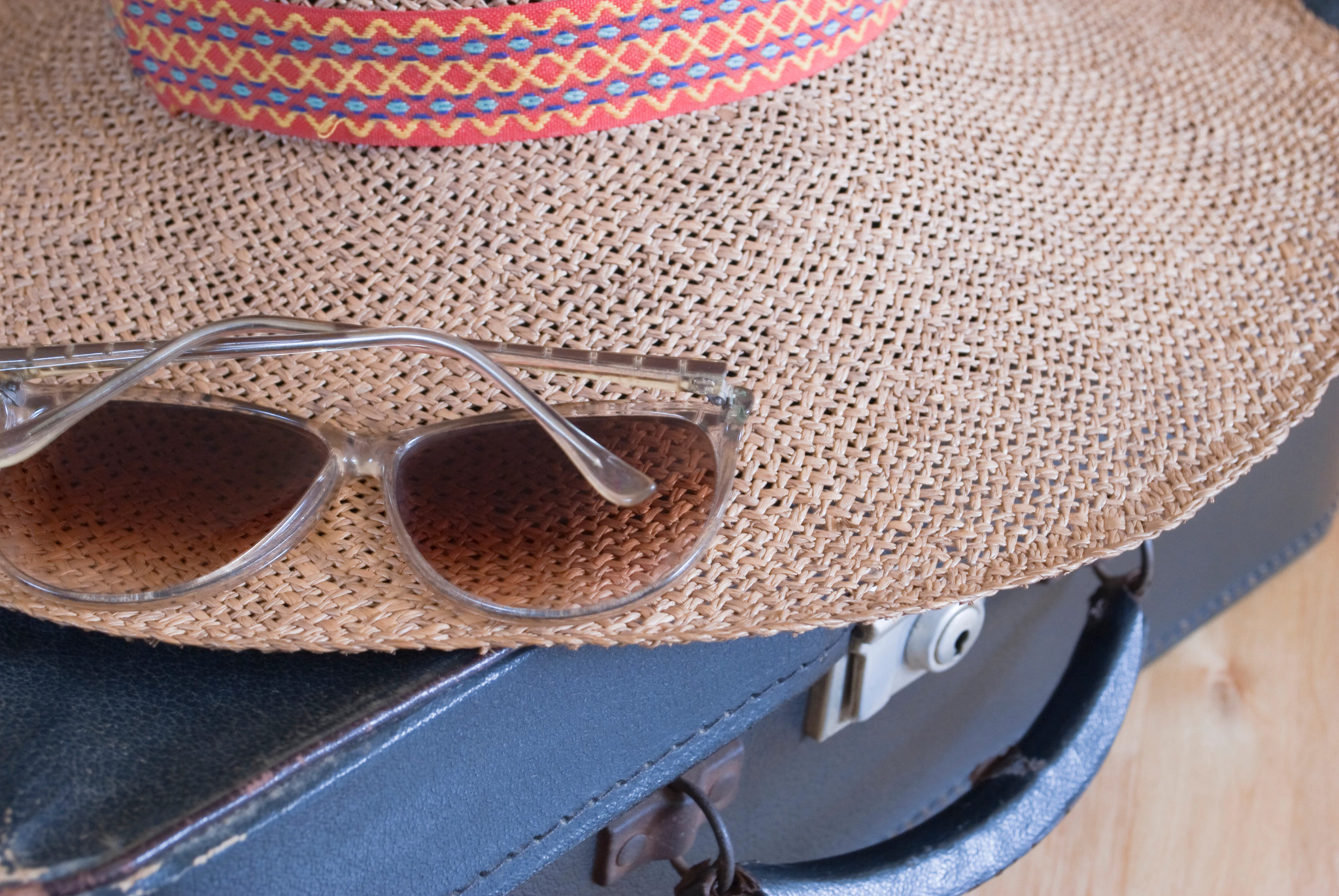 sunglasses, a hat and briefcase