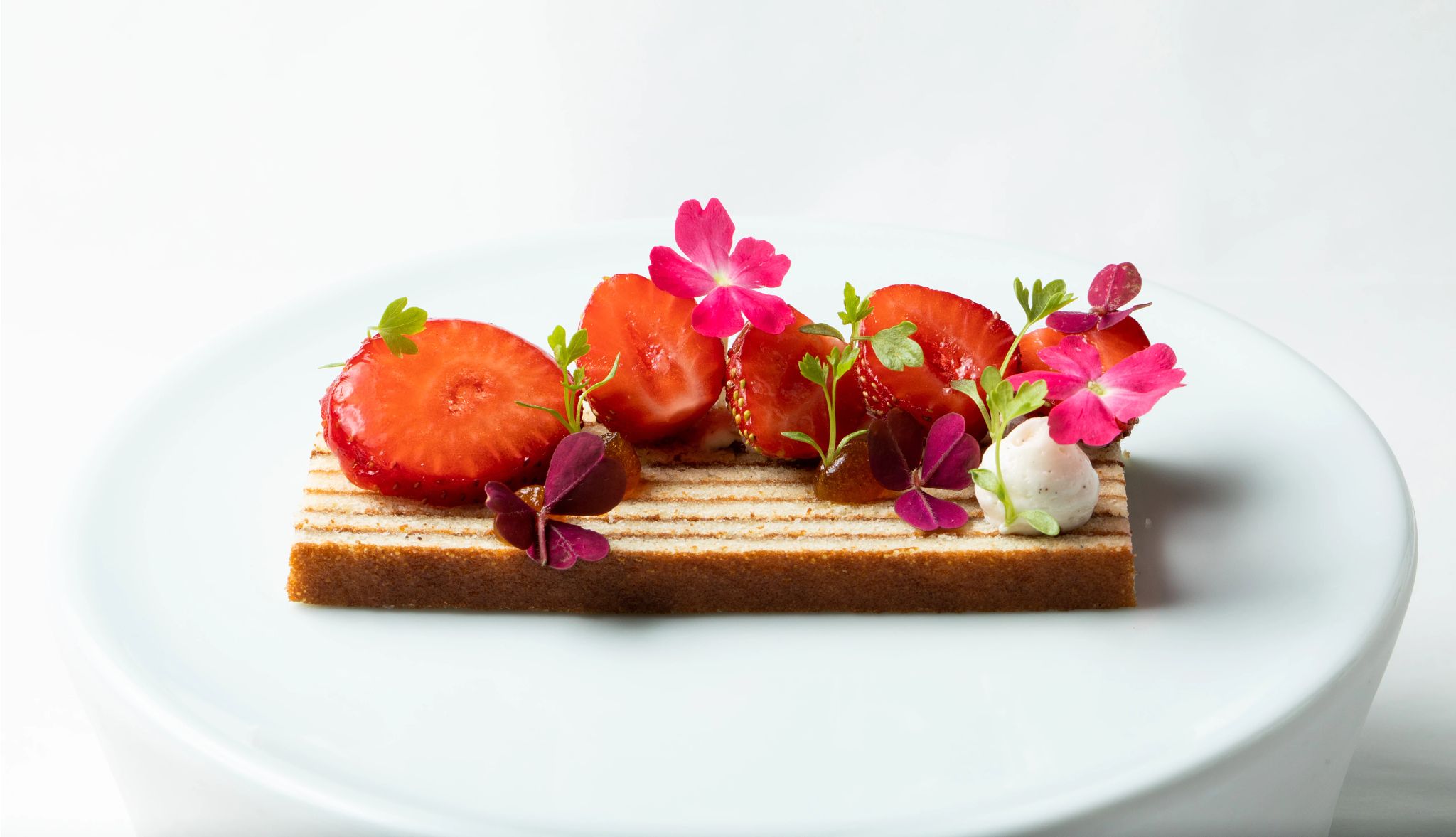 If you can afford it, eating at a Michelin restaurant is worth it strawberry dessert decorated on a plate