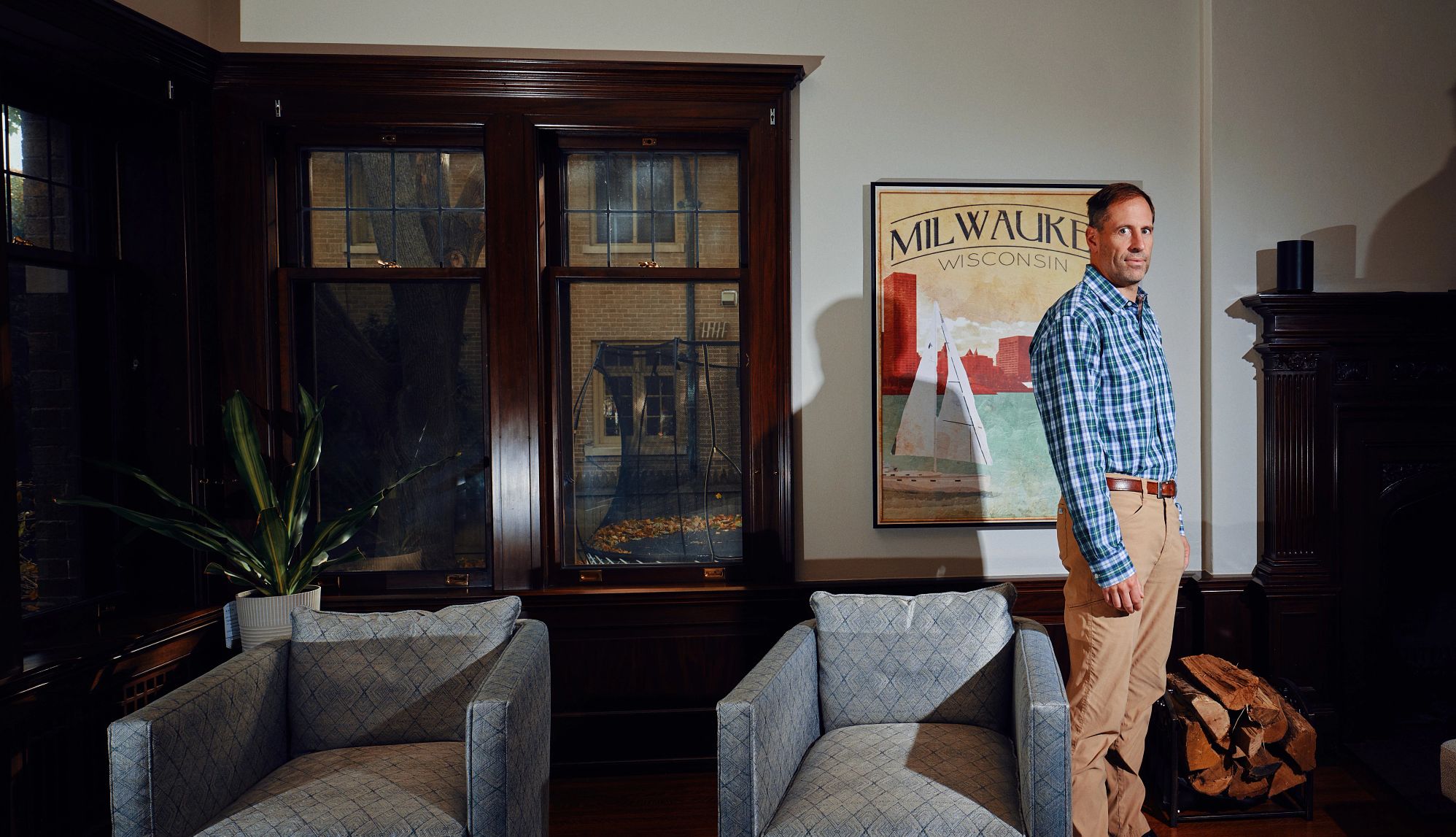 Chris Hitler a man stands in a living room