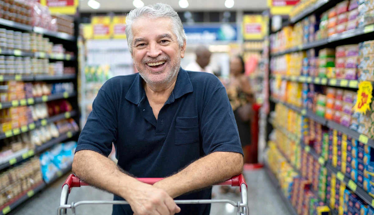Man smiling in grocery store