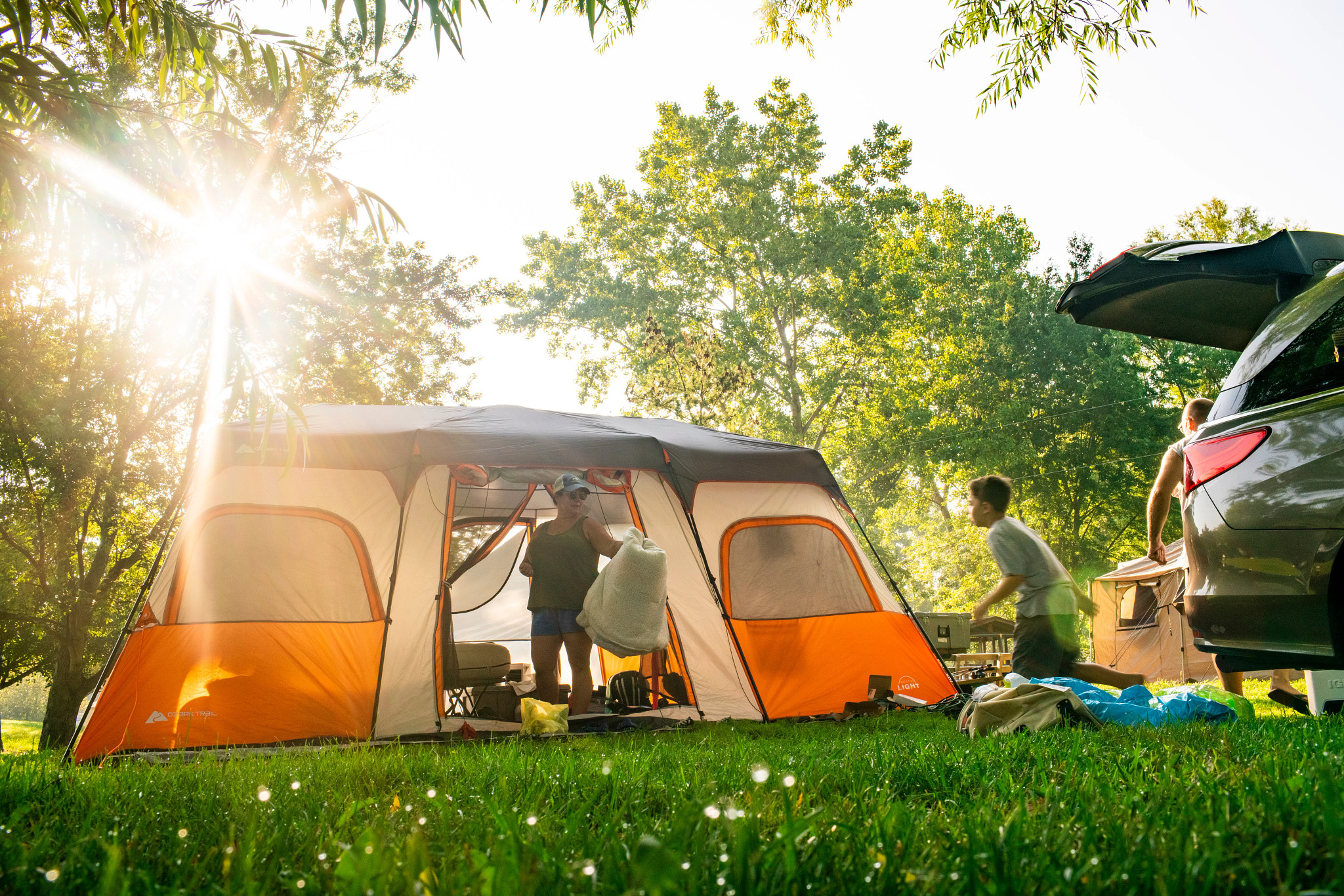 grandparents set up a campsite is set up with a tent and a supplies