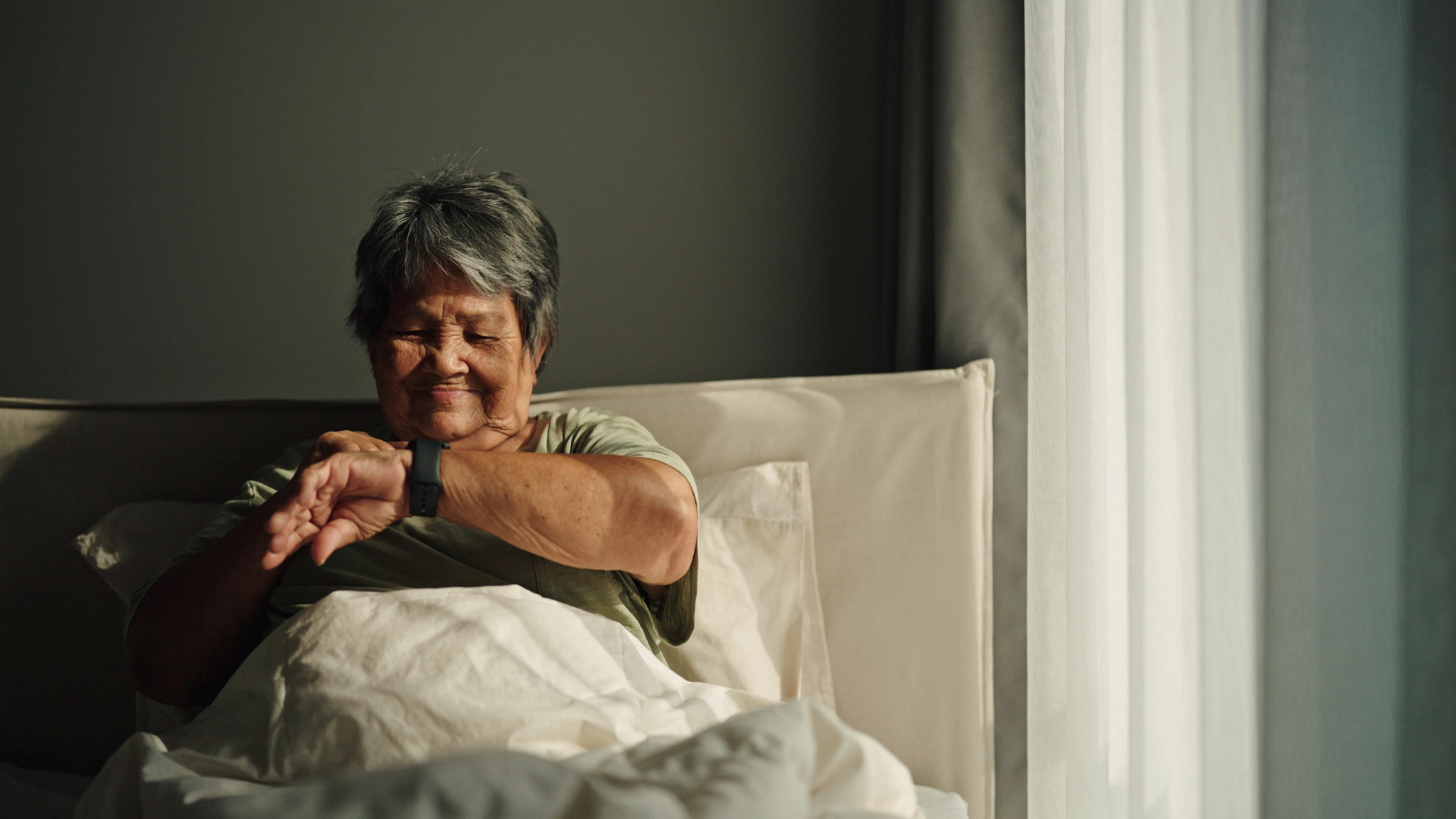 Women checking sleep tracker