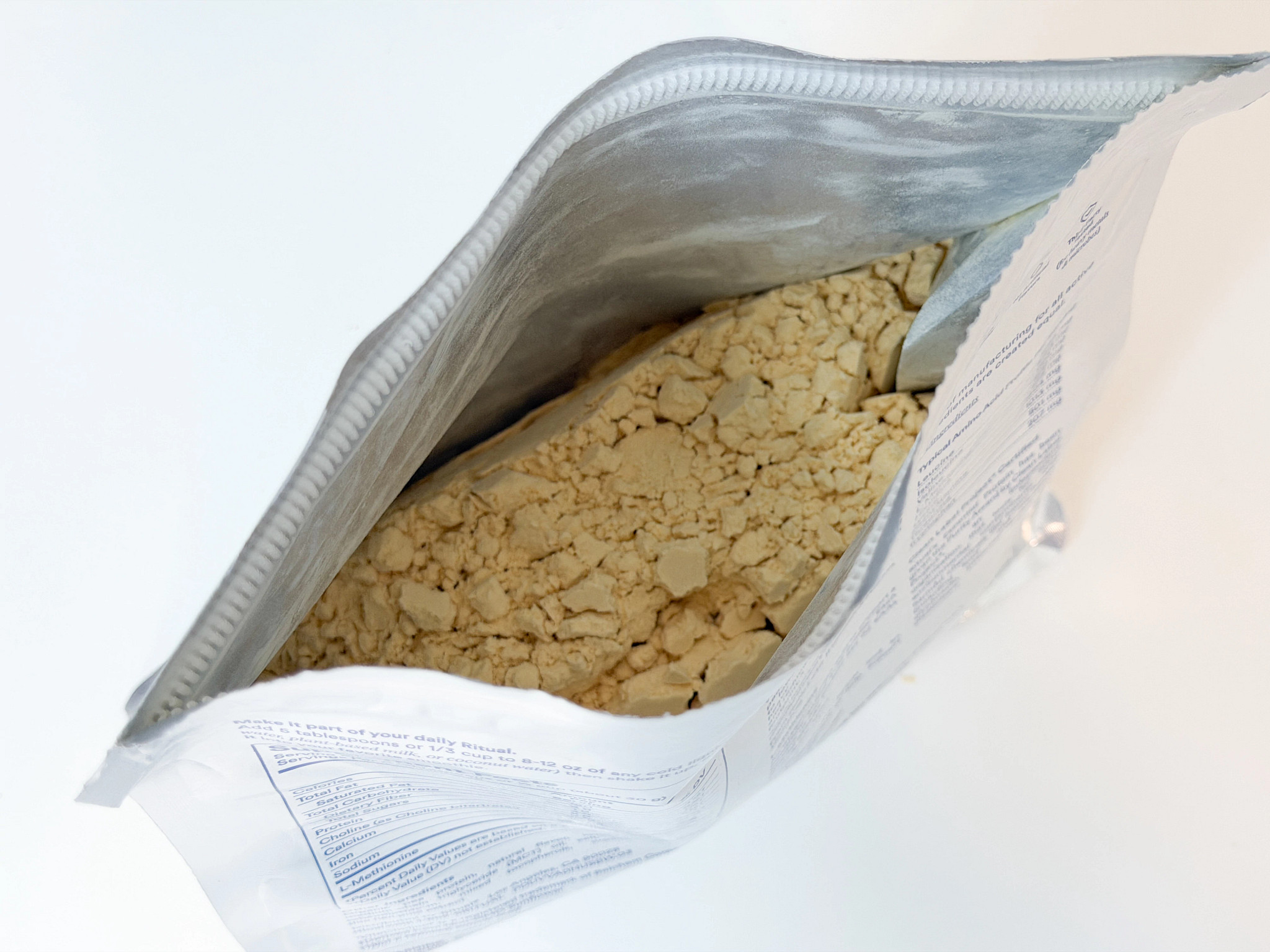 The open top of the Ritual Essential Protein Daily Shake, showing the protein powder inside