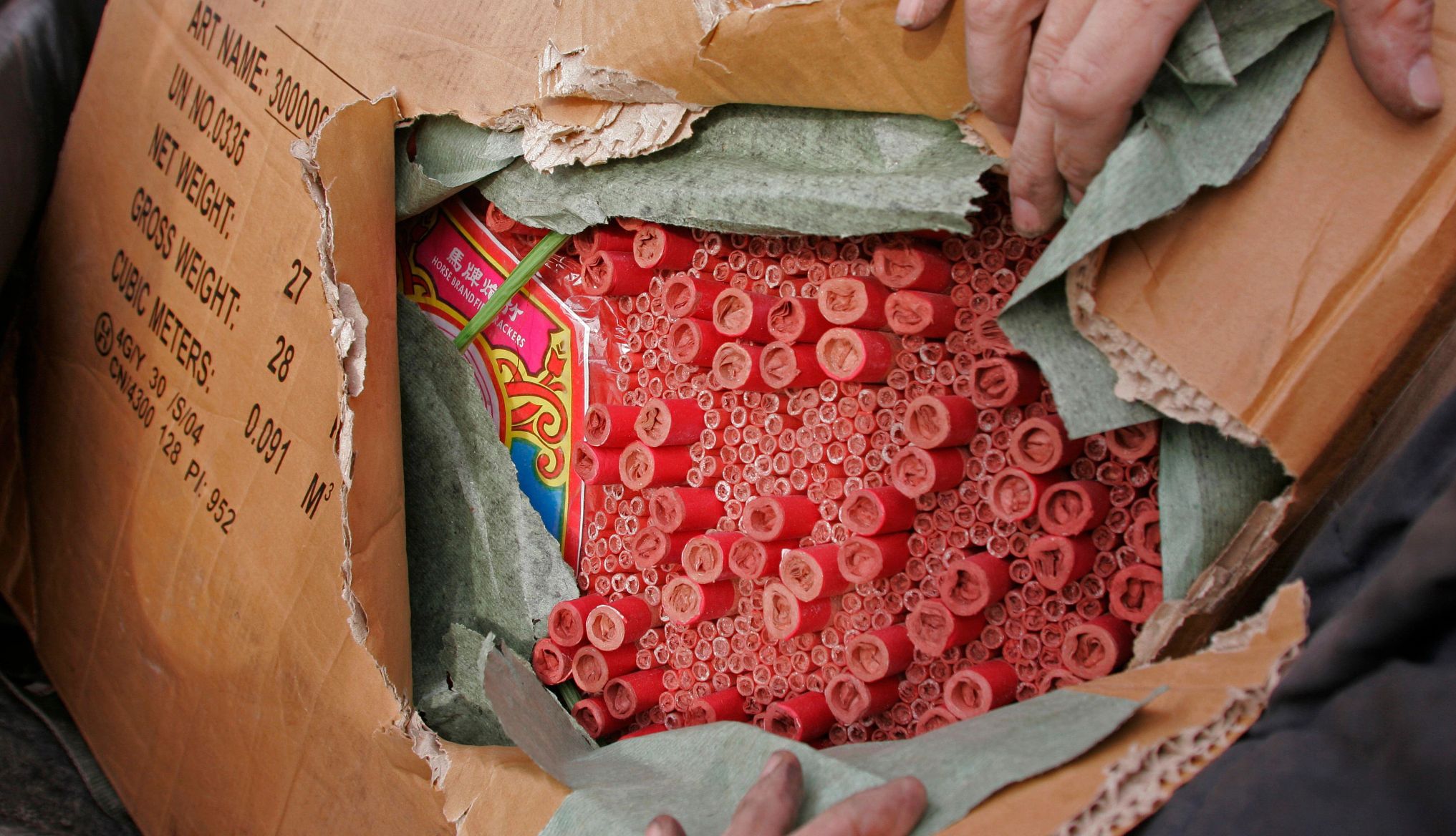 fireworks can not be mailed a person opening a box of fireworks