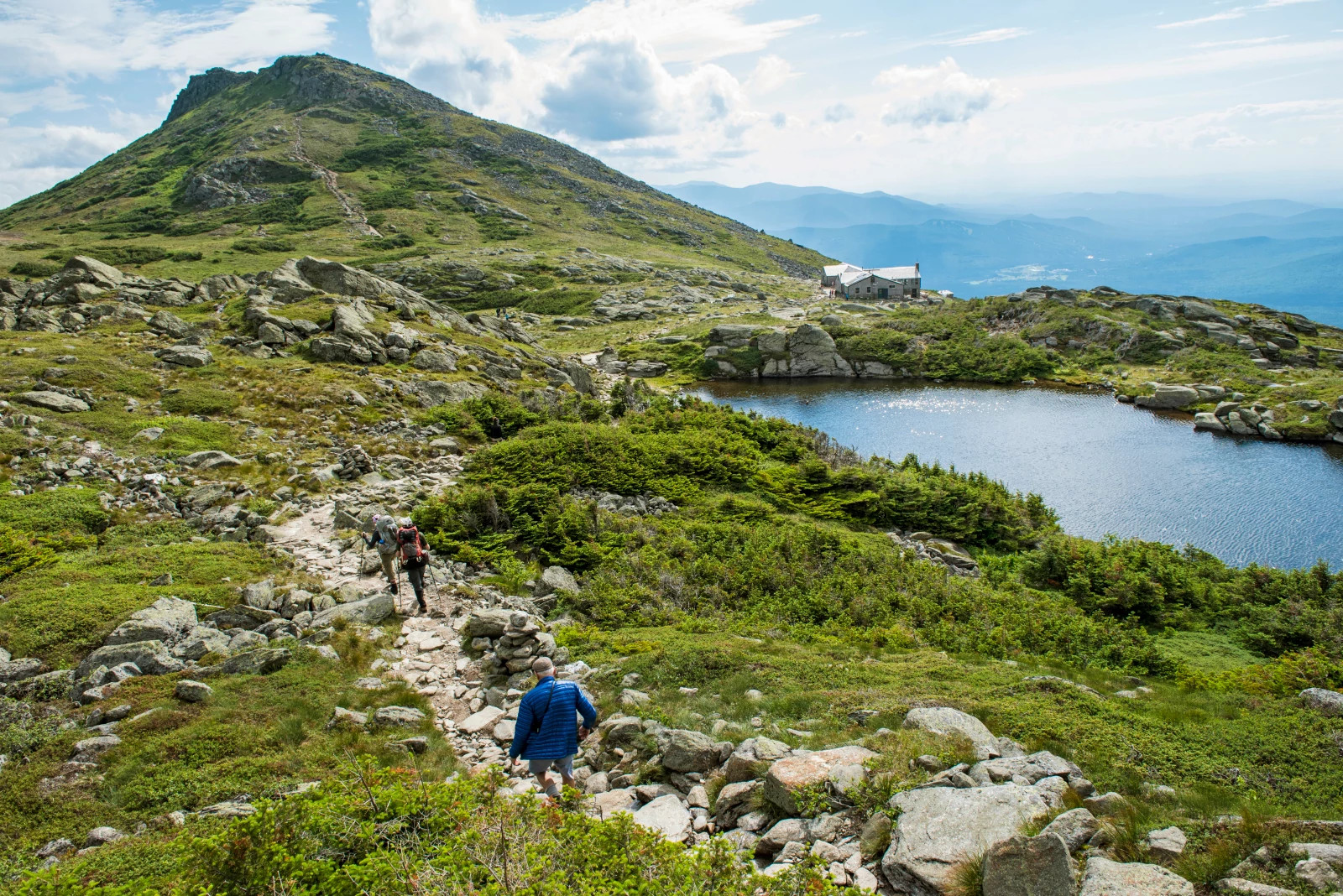 a rock covered path leading up a mountain