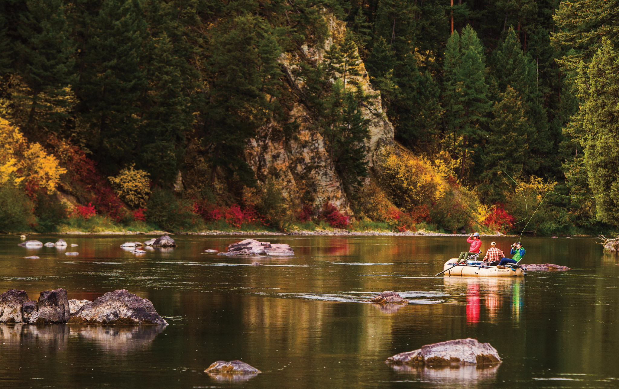 people sitting on a raft in the water