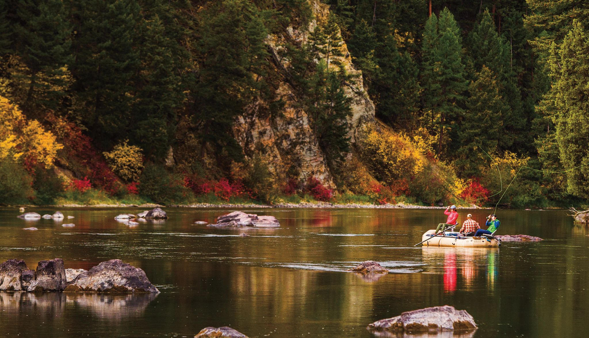 Multigenerational Trips people sitting on a raft in the water