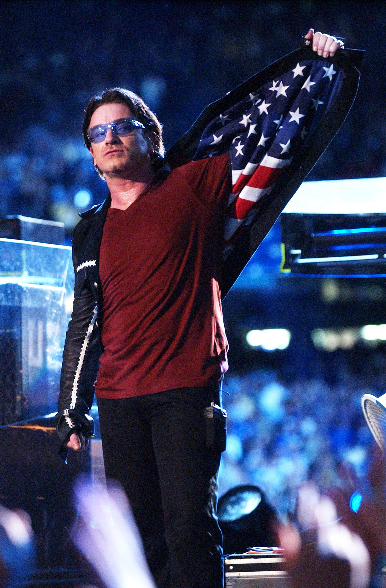 bono performing onstage with u 2