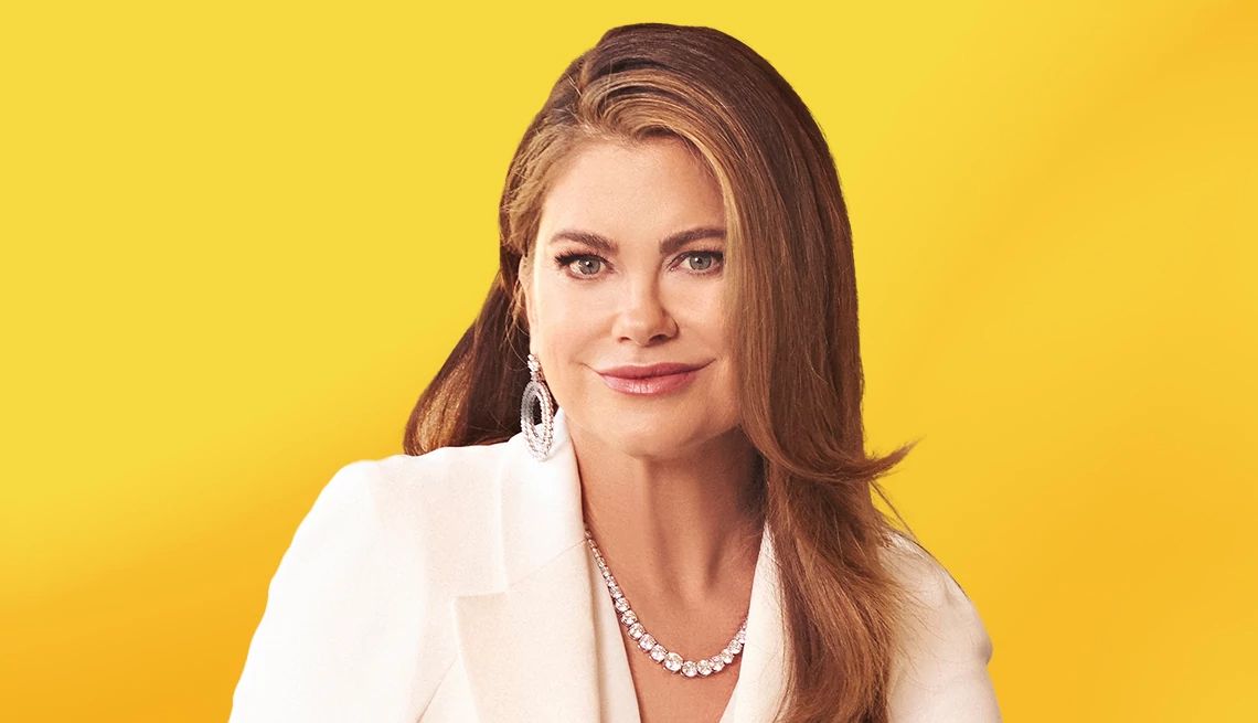 Kathy Ireland against yellow ombre background