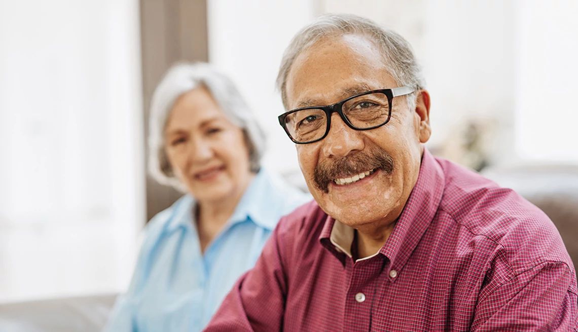 Brain volume is decreasing when we reach our mid-60s A portrait shot of a man with his wife posing for the photo in the background