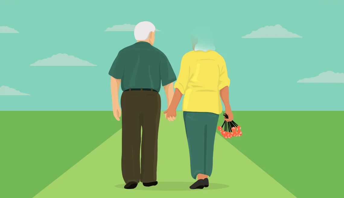 two people walking down a road holding hands