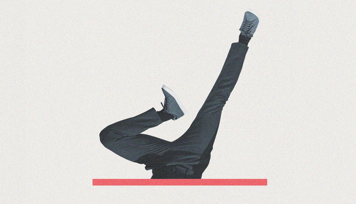 a graphic and photo illustration shows a man throwing himself headfirst through a void, represented by a horizontal red bar, at the bottom of the frame