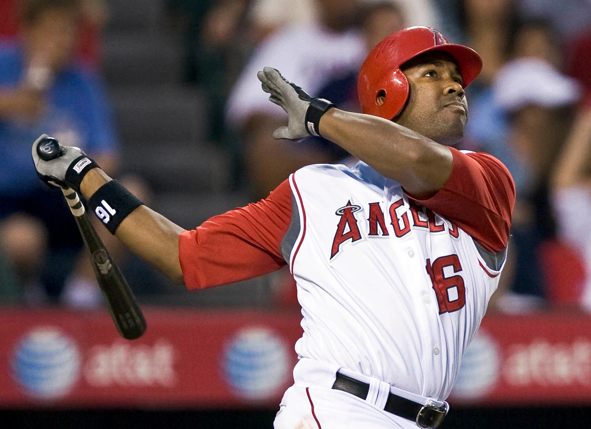baseball player garret anderson swings bat in angels uniform