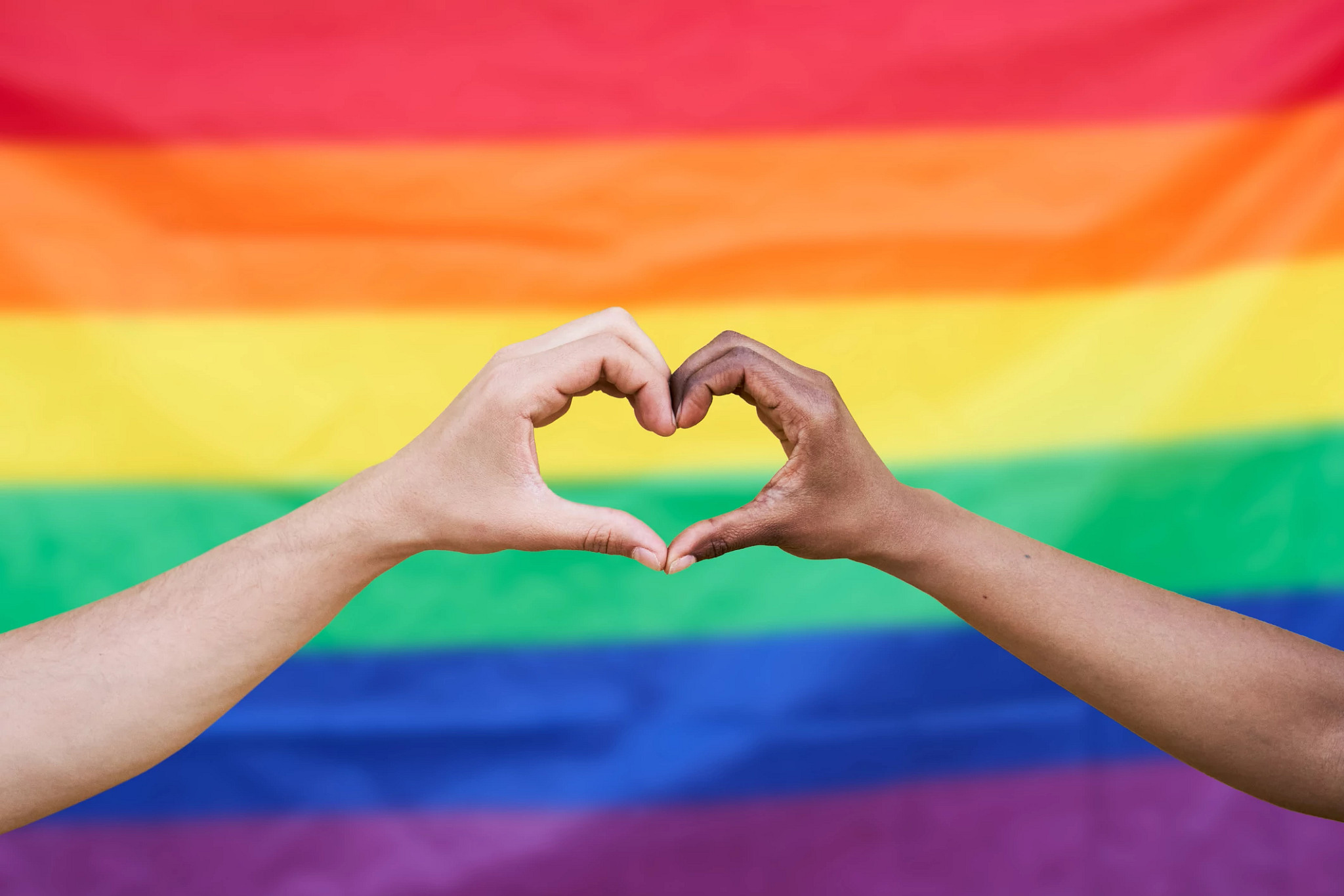 LGBTQ Flag with heart hands