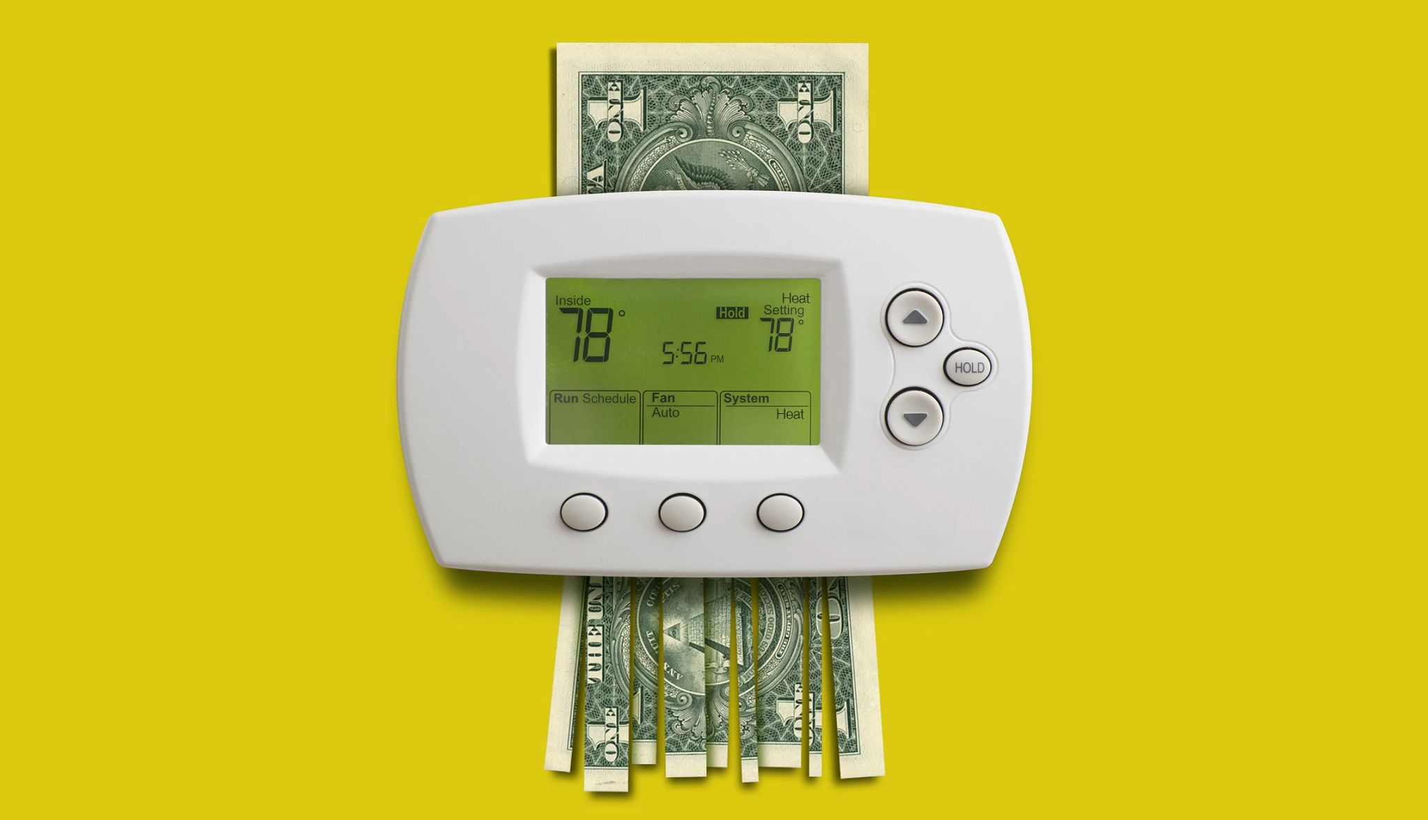 Save on home heating bills home thermostat with a shredded dollar bill running through it
