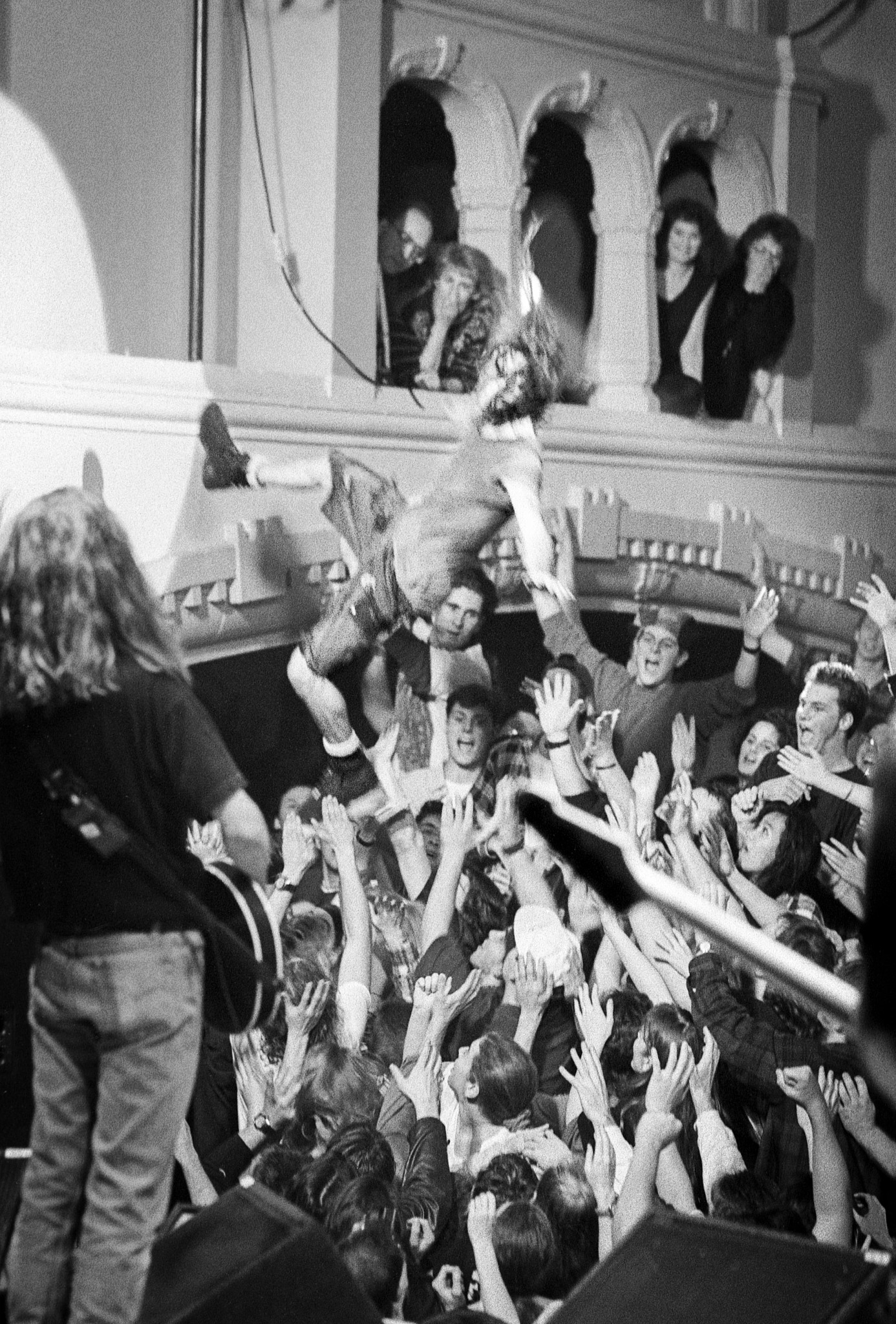 Black and white photo of Eddie Vedder jumping into crowd