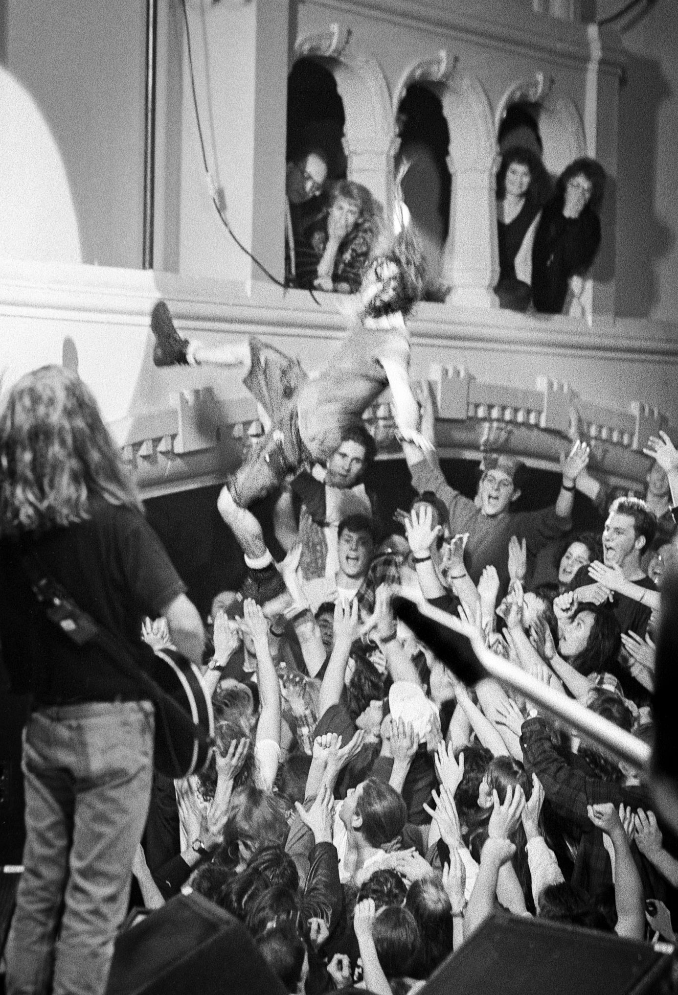 Eddie Vedder jumps into the crowd during a concert in Seattle in 1992 Black and white photo of Eddie Vedder jumping into crowd