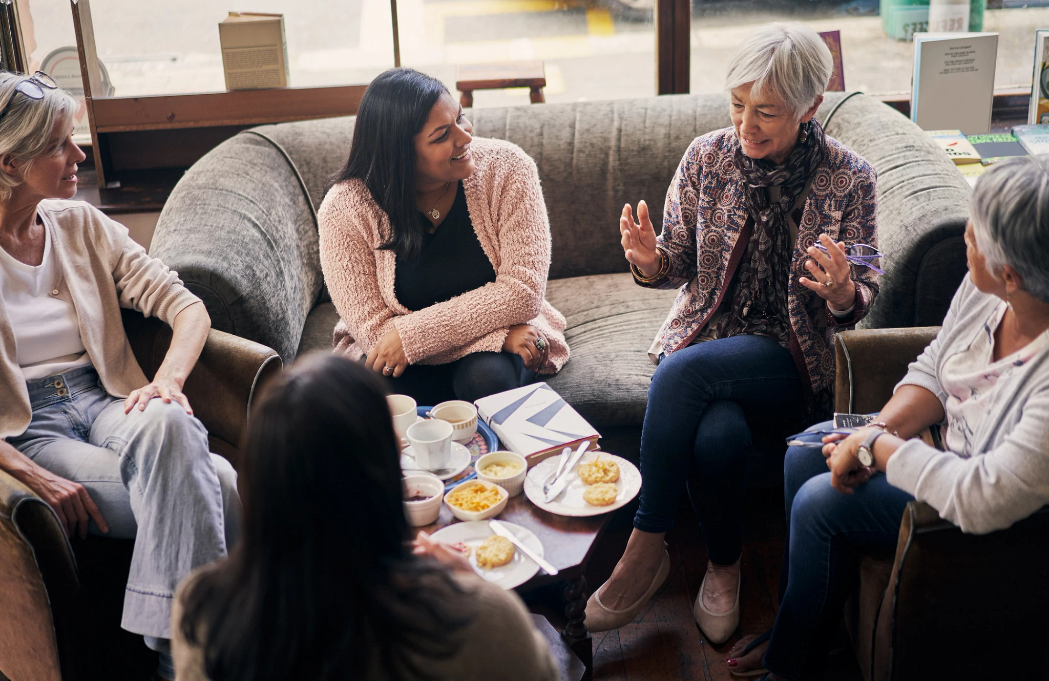 Group of women discussing a book