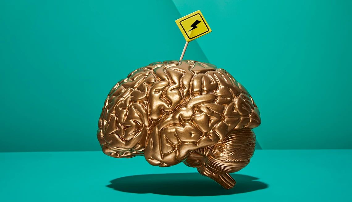 Silent strokes go unnoticed, but the damage to the brain is real A trophy of a brain with a lightning bolt caution sign sticking out of the top of it