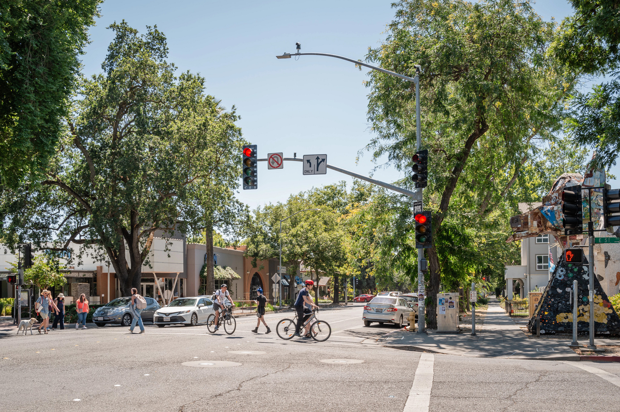 people crossing a street in downtown Davis, California