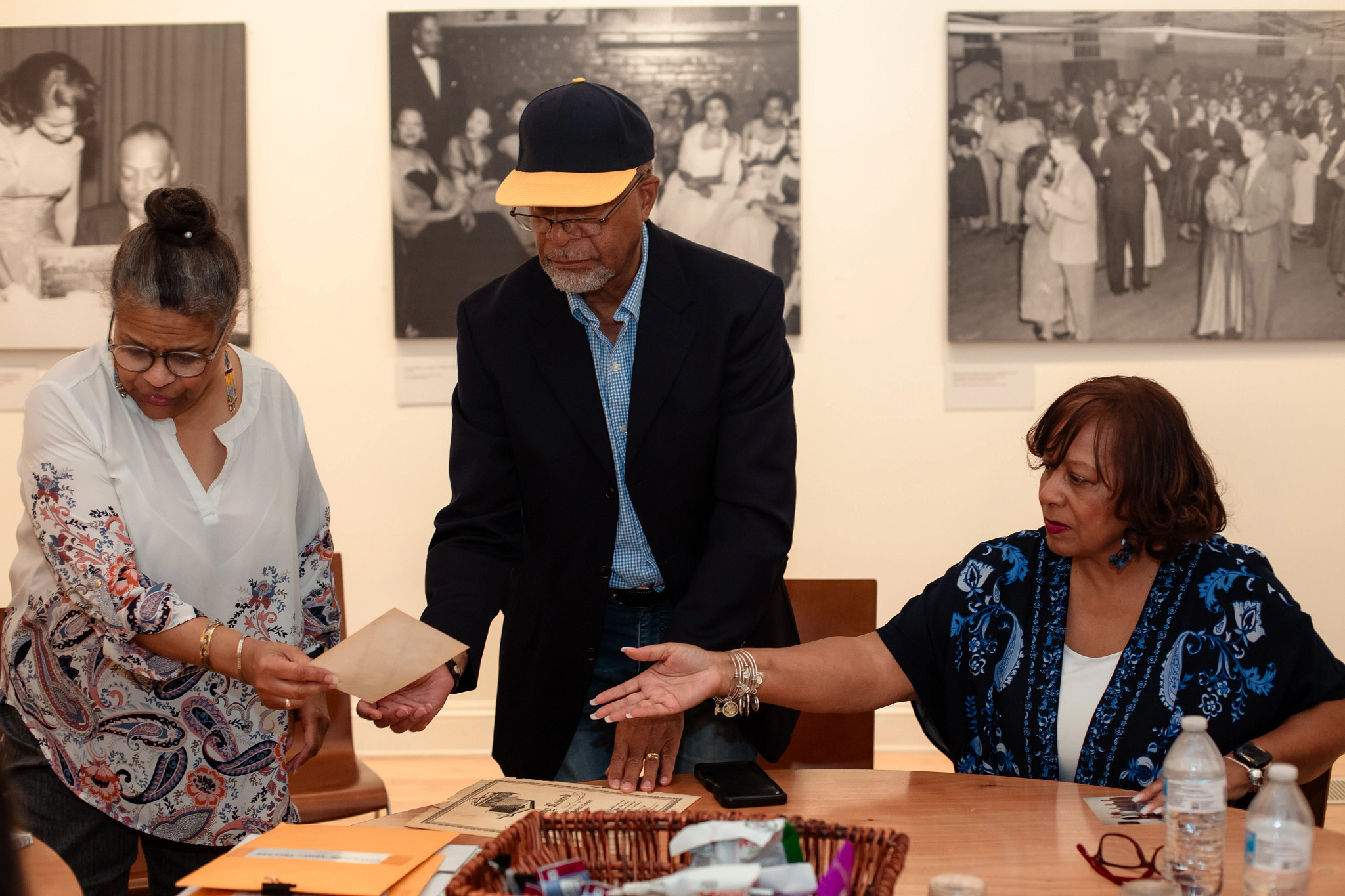 nathaniel pope with two people in front of a museum display